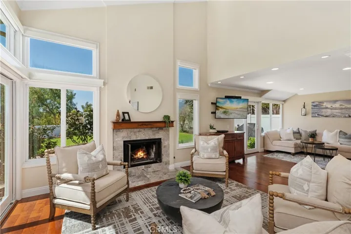 Opened up living space allows a wonderful flow with fireplace being seen by both LR and the FR!