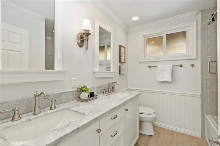 Remodeled with Carrera marble and glass subway tile! New tub and fixtures.
