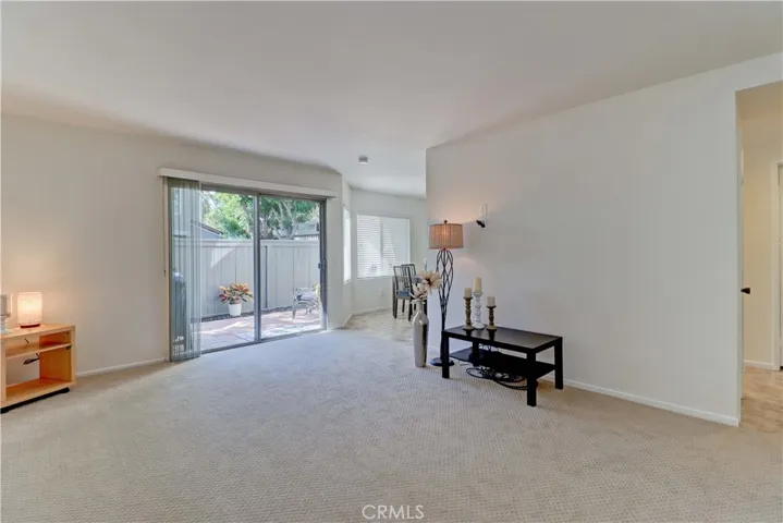 Living room facing enclosed back porch area