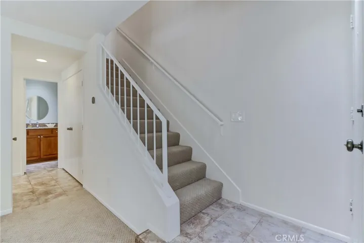 Stairs and half bath entrance