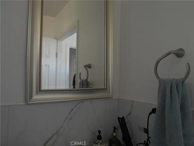 Bathroom with shower, ventilation fan, window
