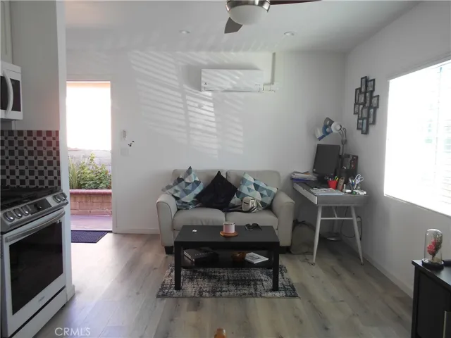 living area with natural light, ceiling fan & recessed lighting