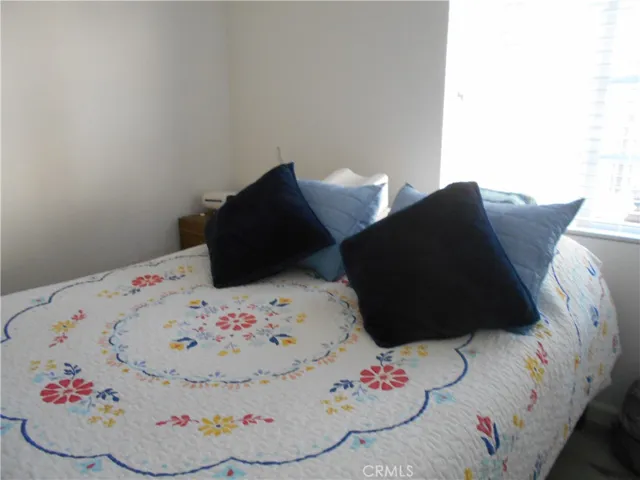 bedroom with north facing window and double-door closet