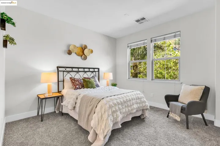 Carpeted bedroom featuring baseboards