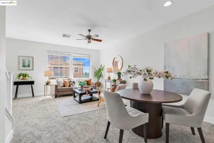 Dining space with carpet flooring and ceiling fan