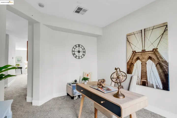 Carpeted office space with baseboards