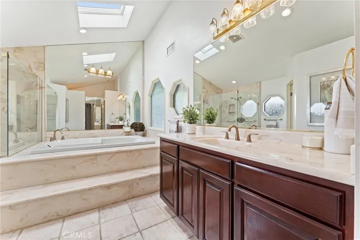 The best view of the large vanity and the bath tub.  During the day this room is full of natural light from the skylight.