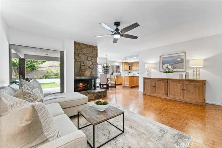 This is your family room view looking onto the dining area and kitchen, where the parquet floors continue,