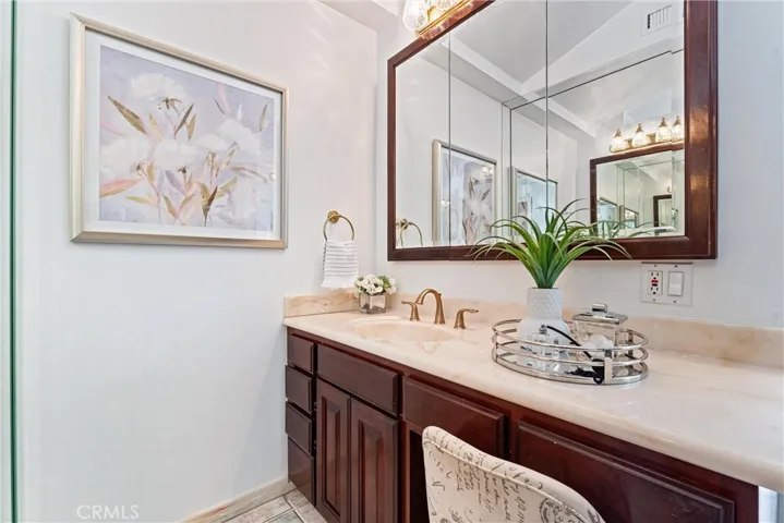 Entering the bathroom suite you stop at the first vanity and dressing area.