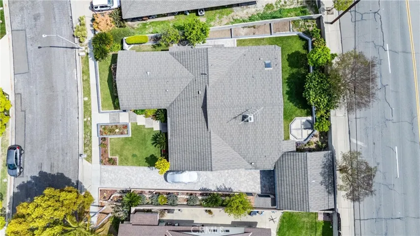 The overhead view shows the expanse of the long driveway and the other planters along the south side of the property.