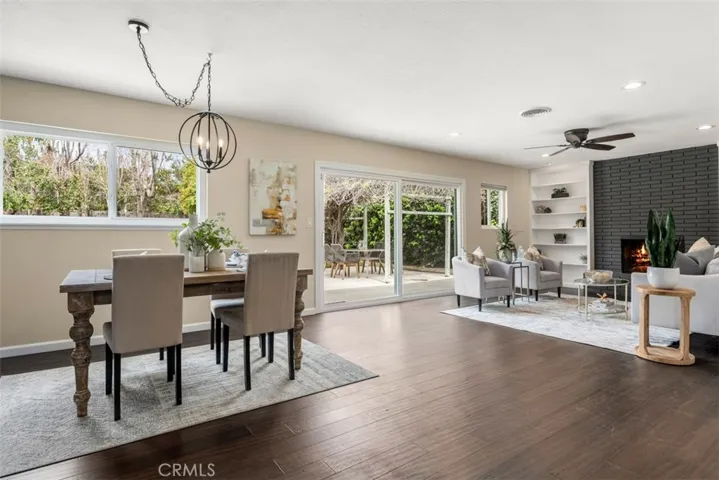 The kitchen opens to a spacious dining and living area. The potential to make this amazing is nearly unlimited. [The fire in the fireplace is a digital image.]