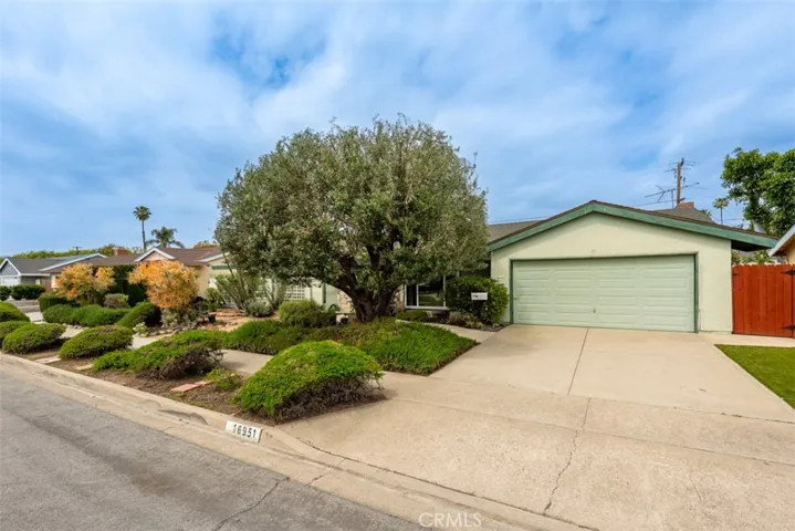 Two-garage and full-length driveway. Water-conserving xeriscape landscaping in the front yard.