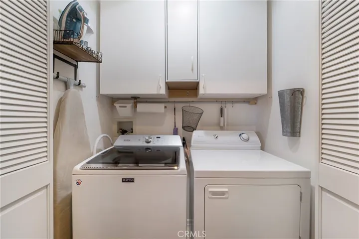 Upstairs laundry offers washer and dryer with sale.