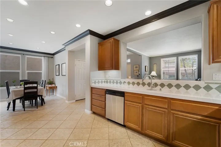 The kitchen opens to the dining room.