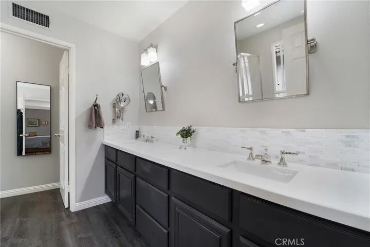 Dual vanities grace the owner's suite bath.