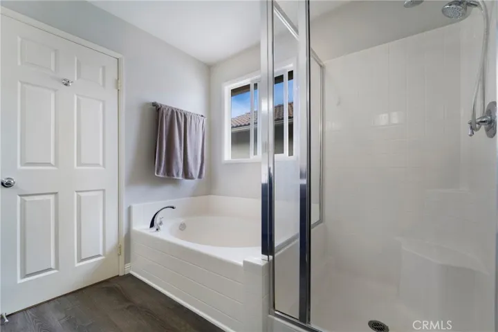 Separate soaking tub and shower.