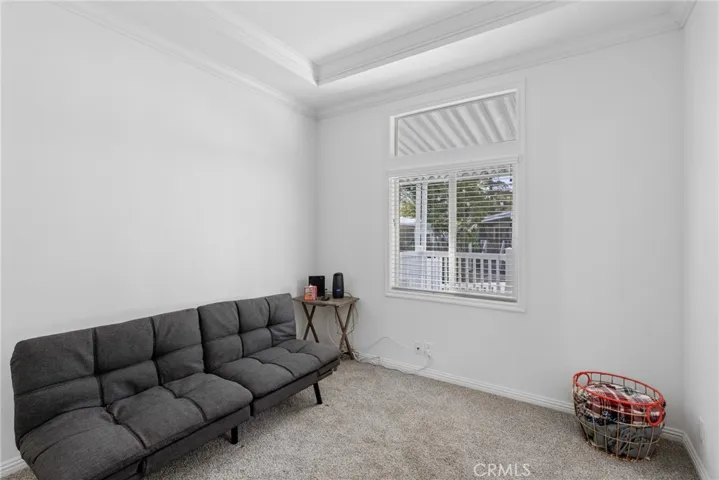 Den with barn door access. coffered ceiling