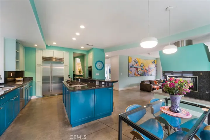 Looking towards the kitchen, prep space and family room.