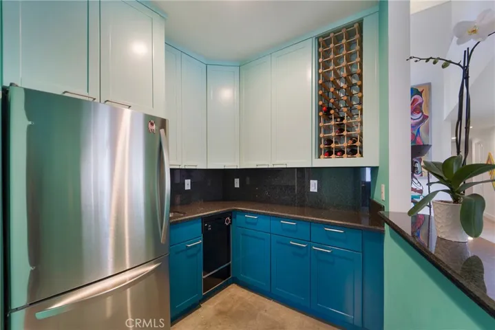 Prep kitchen or generously sized bar with wine storage.