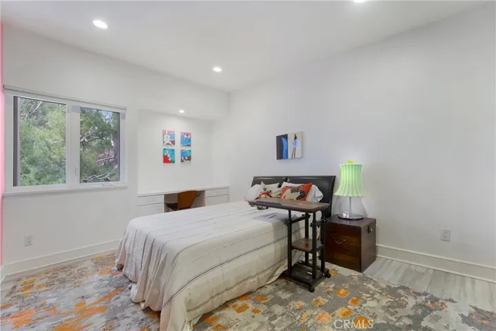 One of the secondary bedrooms with built in study area.