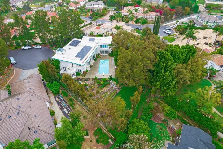 Nestled into trees at the end of the cul de sac sits this custom gem!