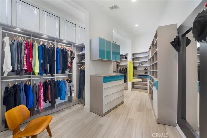 Enviable recently remodeled owner's suite closet.