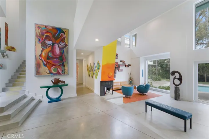 The 20 ft. ceilings welcome you in, as natural light shines in through all the glass.