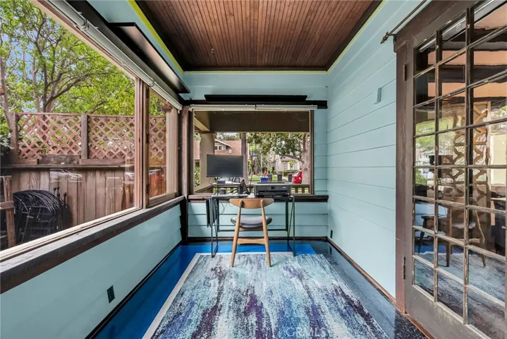 Office space accessed from the living room that was at one time part of the wrap around porch.