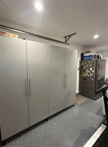Upgraded garage with a water line to a second refrigerator.