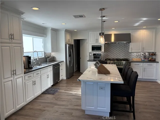 Light, bright, inviting kitchen that's family friendly.