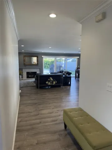 Front entrance leads to open floor plan with a view of the backyard.