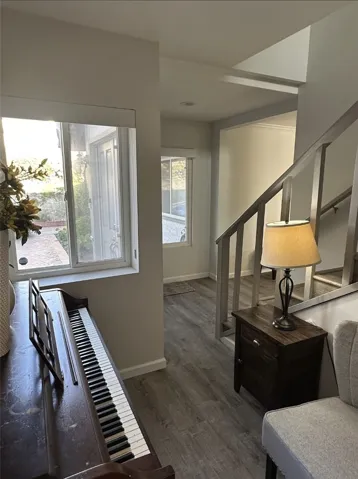 Front entrance with stairs leading to the converted primary suite.