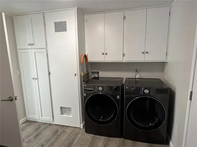 Washer & dryer in pantry between kitchen and garage.