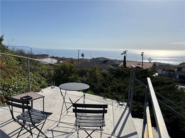 Paved hilltop patio with panoramic views of Catalina Island and the coastline.