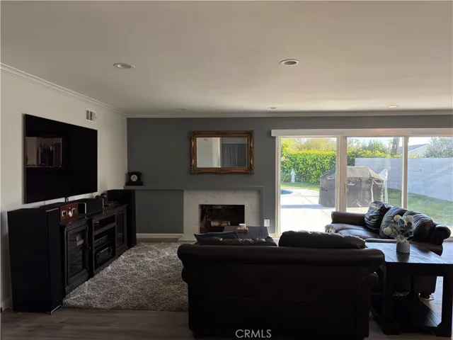 Comfortable, spacious living room with gas fireplace.