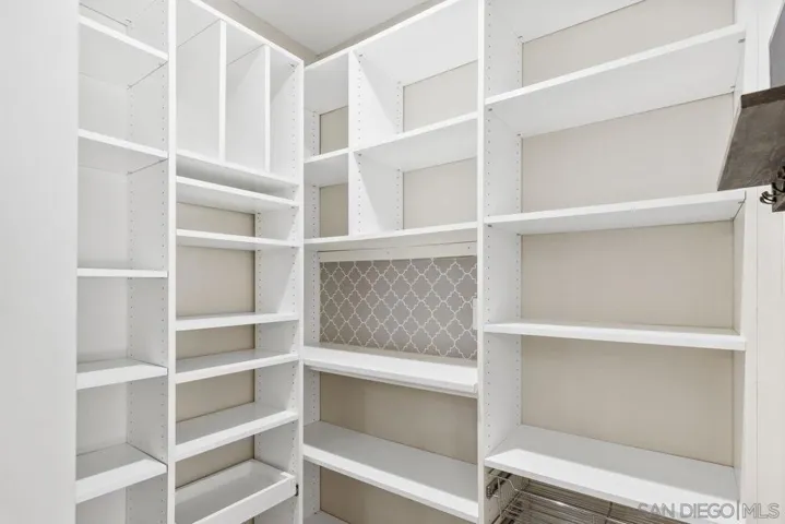 Walk-in pantry with all custom shelving. Built to fit all your storage needs
