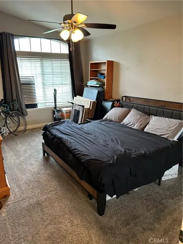 The secondary bedroom is almost as big as the primary, ceiling fan and Mirrored