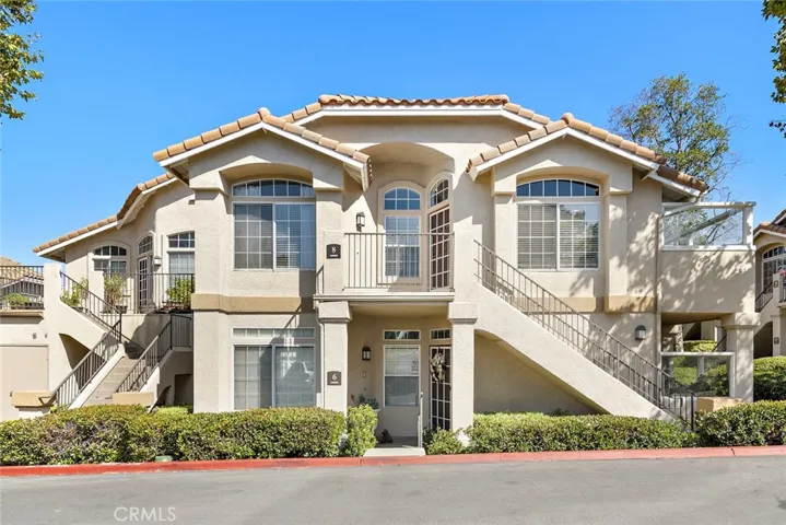 8 Carmesi in the Belflora Community of RSM,  Upper unit right side, south east facing, porch and a large balcony lots of natural light and a direct garage access . Did I mention  Direct Garage Access !!!! Not all units do.