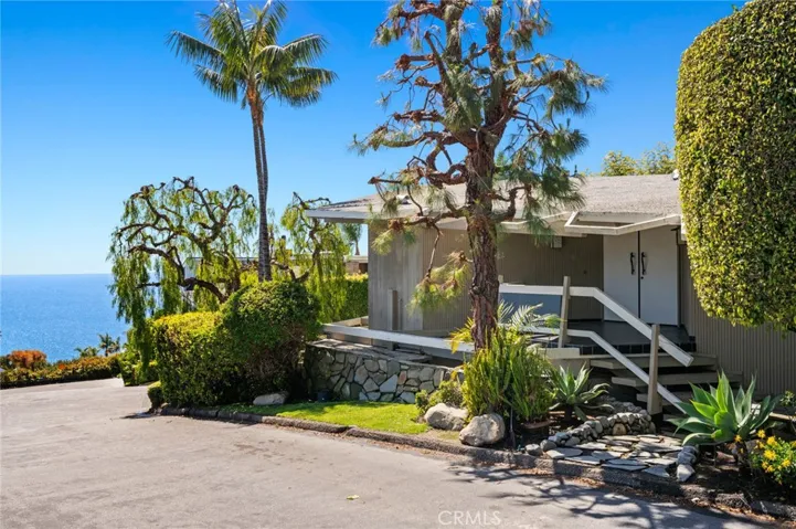 Designed by renowned Laguna Beach architect Chris Abel, this mid-century modern home captures breathtaking Pacific views and timeless architectural character.