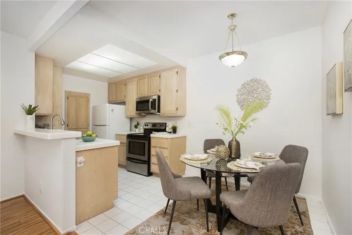 Breakfast bar and well lit kitchen are ideal for all your living needs