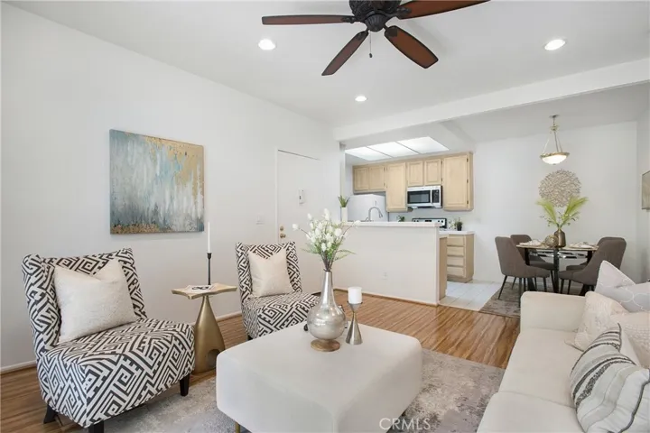 Living room flows seamlessly with kitchen and dining area
