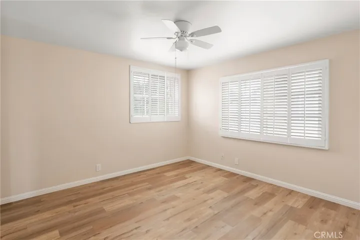 secondary bedroom with ceiling fan, walk-in closet and loads of natural light & fabulous views