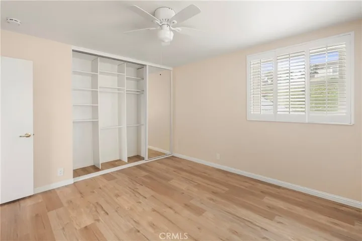 Secondary bedroom with triple mirrored wardrobe
