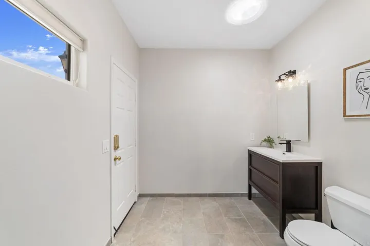 Bathroom with convenient direct access to the outdoors—perfect for guests or coming in from the yard
