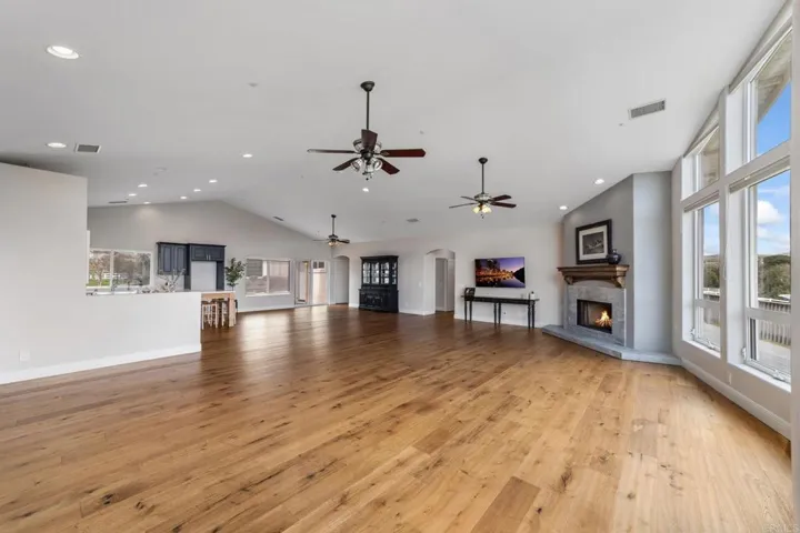 Open-concept living room and kitchen with seamless flow and stunning views.