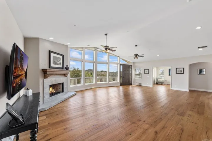 The living room offers stunning views of the mountains and open pastures—perfect for horses.