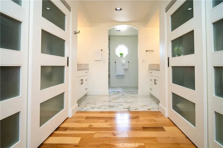 Closets with Customized Sliding Doors on Both Sides and Dual Sinks
