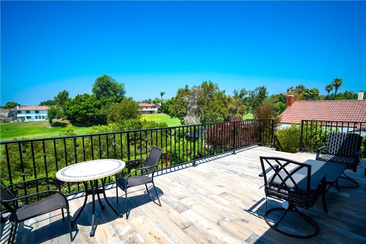 View from the Upstairs Balcony -New Deck with Stairs Providing Direct Access to the Backyard