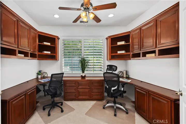 Dedicated office workspace with custom built-ins
