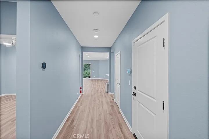 Hallway to Kitchen and Living Room, and Primary Bedroom